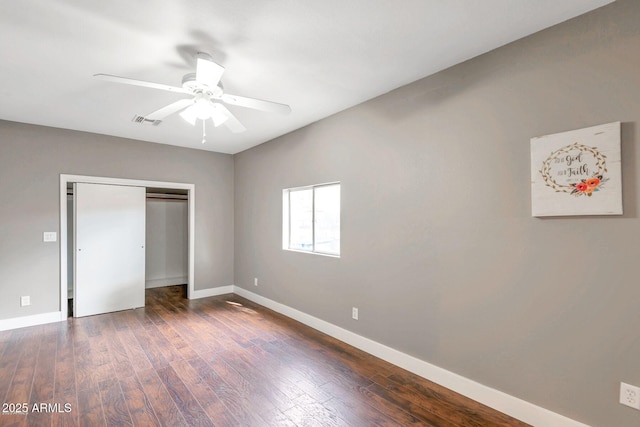 4427 W Crittenden Ln, Phoenix, AZ 85031 - unfurnished bedroom featuring baseboards, dark wood-type flooring, a closet, and ceiling fan