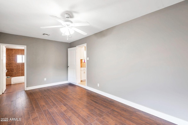 4427 W Crittenden Ln, Phoenix, AZ 85031 - unfurnished room with a ceiling fan, baseboards, and dark wood-type flooring