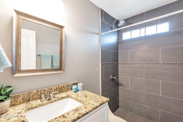 4427 W Crittenden Ln, Phoenix, AZ 85031 - full bathroom with vanity and a tile shower