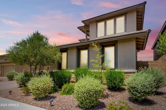 prairie-style home with stucco siding