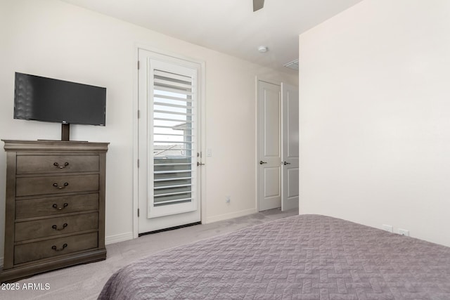 carpeted bedroom with baseboards and a ceiling fan