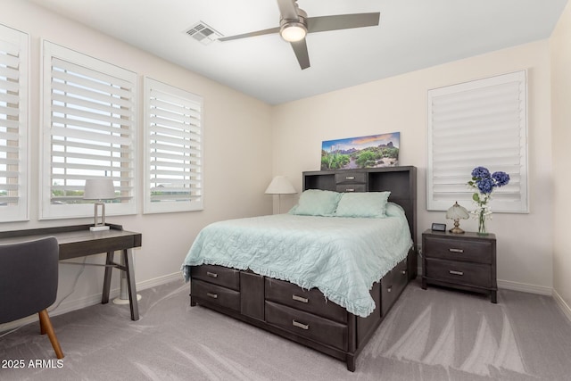 bedroom with visible vents, baseboards, ceiling fan, and light carpet