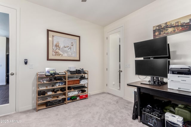 carpeted office featuring baseboards