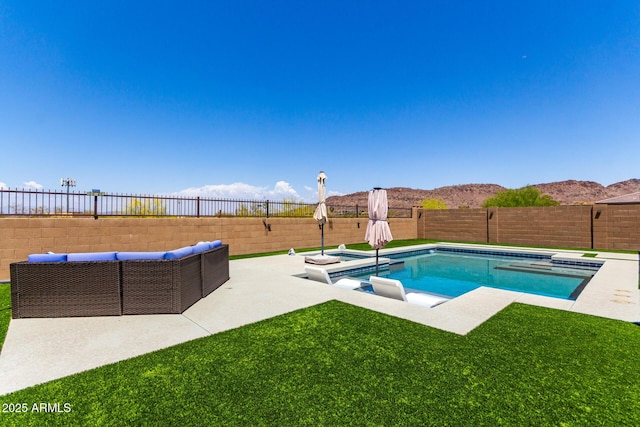 view of swimming pool featuring a patio, a fenced backyard, a fenced in pool, a jacuzzi, and an outdoor hangout area