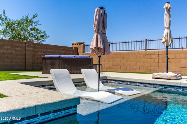 view of patio with fence and a fenced in pool