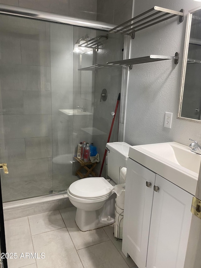 3229 W Cholla St, Phoenix, AZ 85029 - bathroom featuring vanity, toilet, a shower stall, and tile patterned flooring