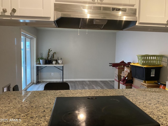 3229 W Cholla St, Phoenix, AZ 85029 - kitchen with ventilation hood, white cabinets, wood finished floors, and light stone countertops