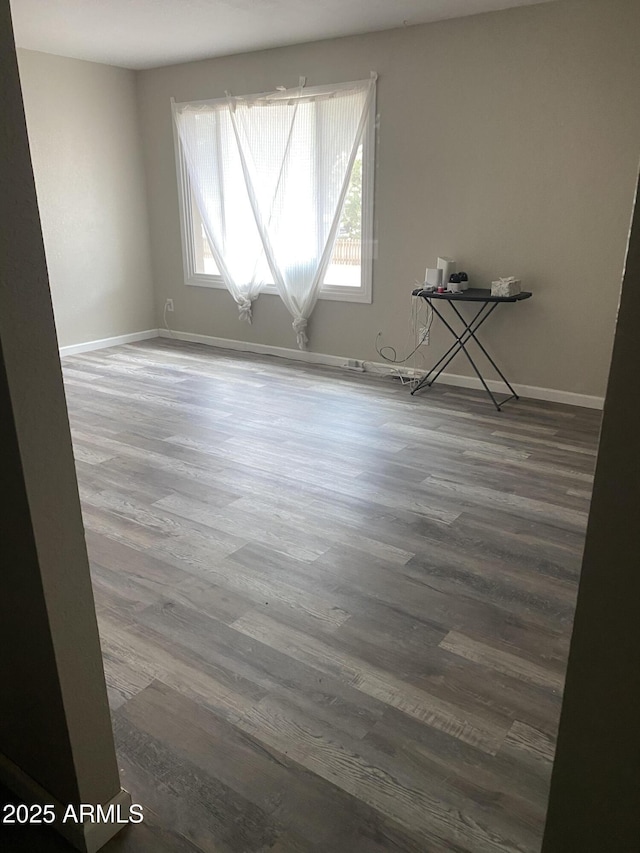 3229 W Cholla St, Phoenix, AZ 85029 - empty room featuring wood finished floors and baseboards