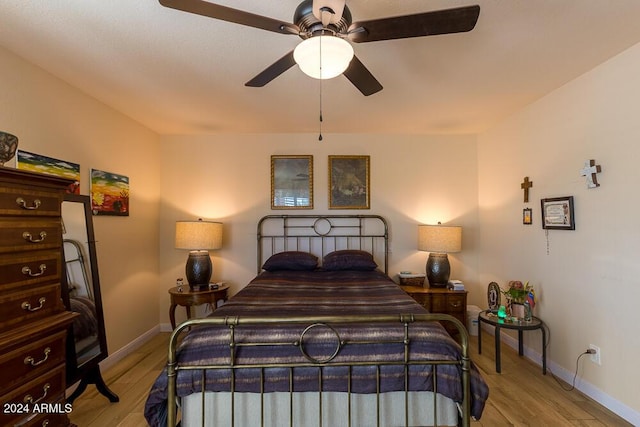 bedroom featuring ceiling fan and light hardwood / wood-style floors