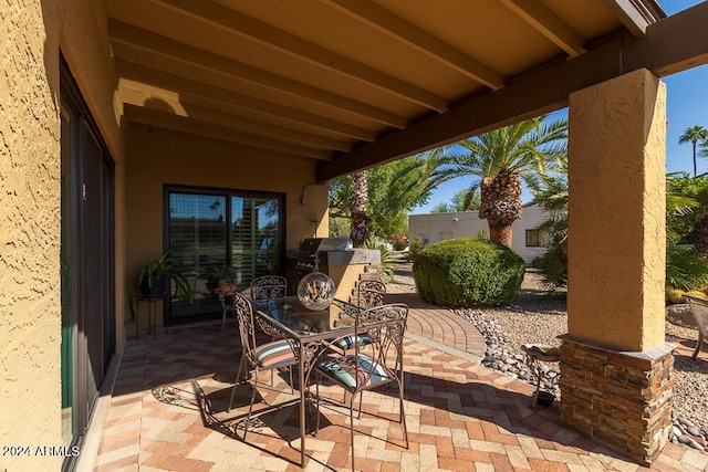 view of patio featuring a grill