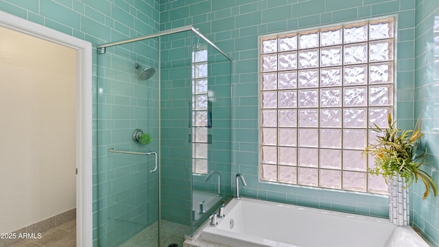 3956 S Hollyhock Pl, Chandler, AZ 85248 - bathroom featuring speckled floor, baseboards, a stall shower, and a garden tub