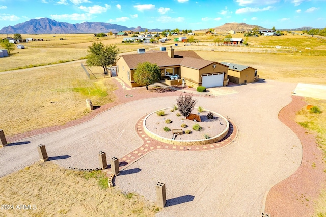 drone / aerial view featuring a mountain view and a rural view