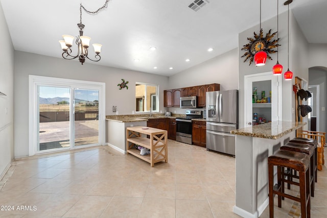 kitchen featuring a peninsula, light tile patterned floors, visible vents, and appliances with stainless steel finishes