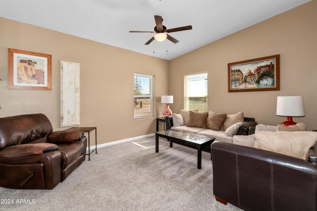 living area featuring lofted ceiling, ceiling fan, light carpet, and baseboards