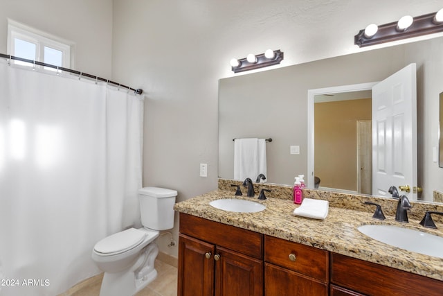full bath featuring double vanity, a sink, toilet, and tile patterned floors