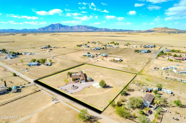 aerial view featuring view of desert, a mountain view, and a rural view