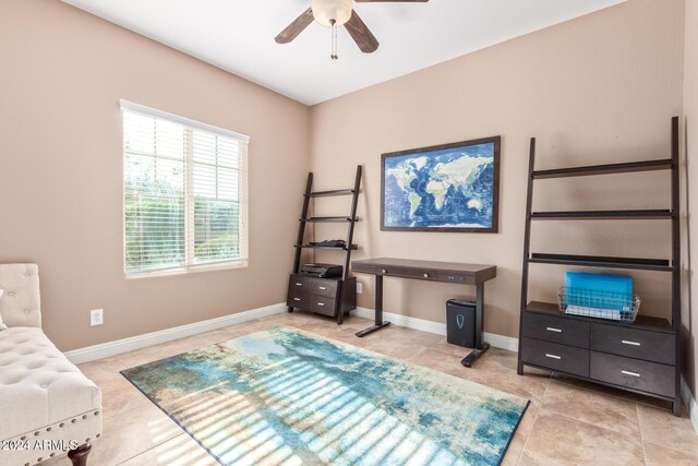 bedroom with ceiling fan and light tile patterned flooring