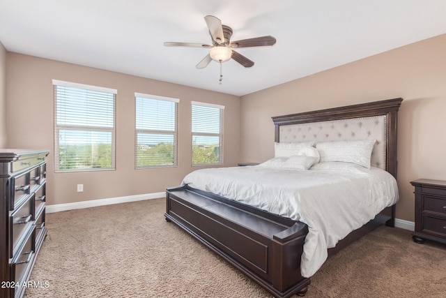 bedroom with carpet, multiple windows, and ceiling fan