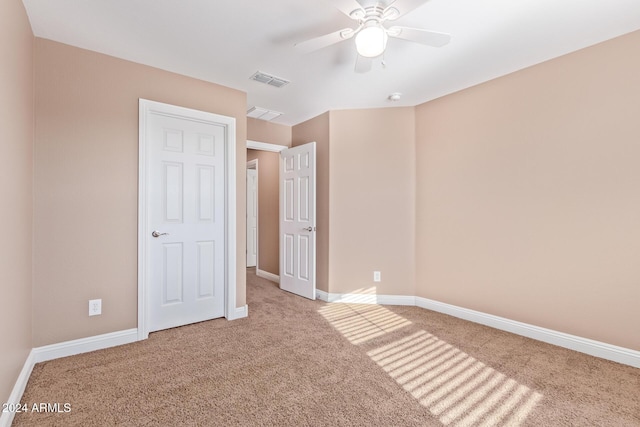 unfurnished bedroom featuring ceiling fan and carpet