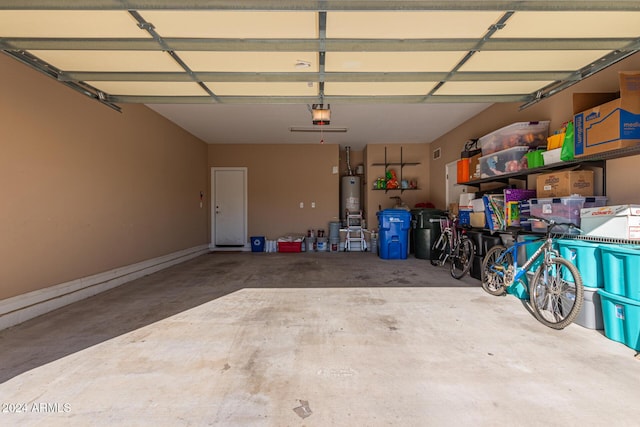 garage featuring gas water heater and a garage door opener