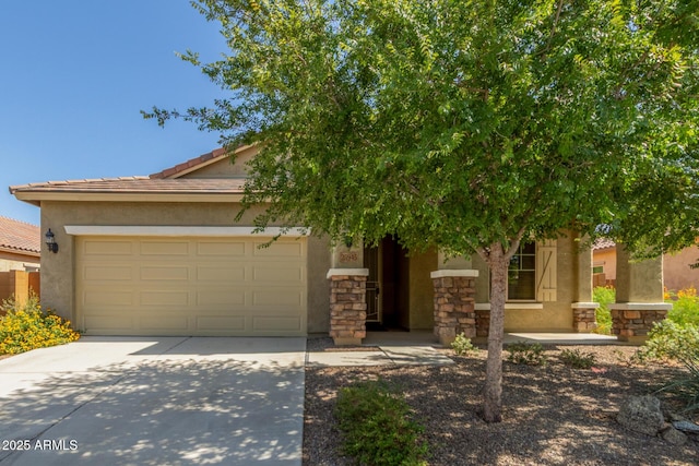25945 W Runion Dr, Buckeye, AZ 85396 - obstructed view of property with driveway, an attached garage, stucco siding, stone siding, and a tile roof