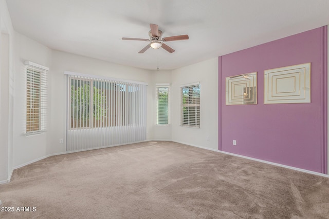 25945 W Runion Dr, Buckeye, AZ 85396 - carpeted spare room with ceiling fan and baseboards
