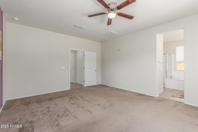 25945 W Runion Dr, Buckeye, AZ 85396 - unfurnished bedroom featuring carpet flooring and connected bathroom