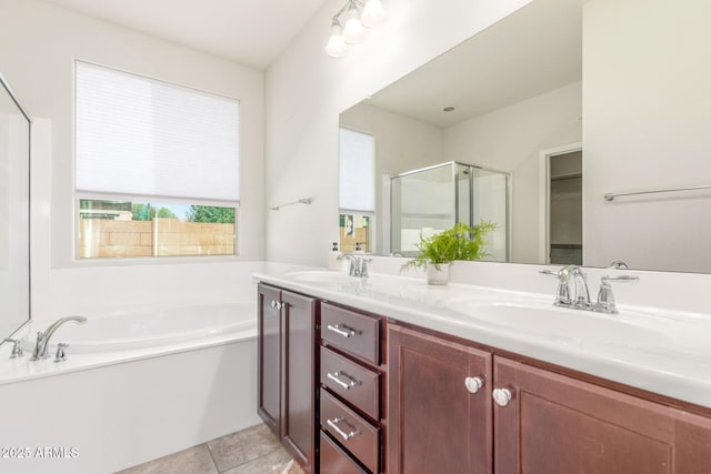25945 W Runion Dr, Buckeye, AZ 85396 - bathroom with a stall shower, a bath, double vanity, and tile patterned flooring