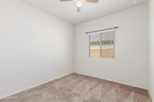 25945 W Runion Dr, Buckeye, AZ 85396 - spare room featuring light colored carpet, ceiling fan, and a smoke detector