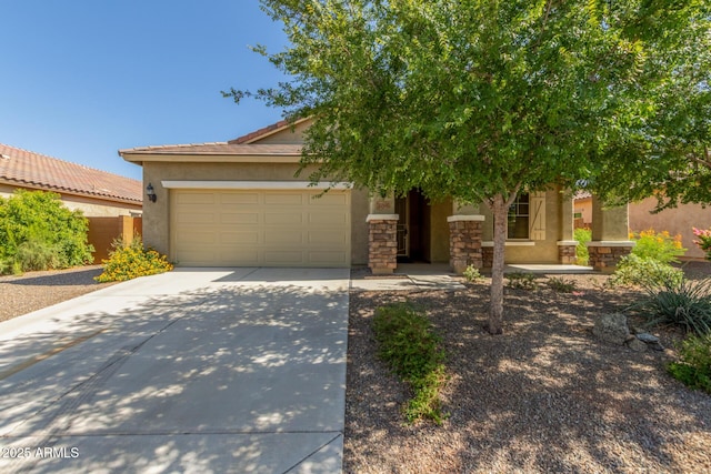 25945 W Runion Dr, Buckeye, AZ 85396 - view of front facade with concrete driveway, a garage, stucco siding, a tiled roof, and stone siding