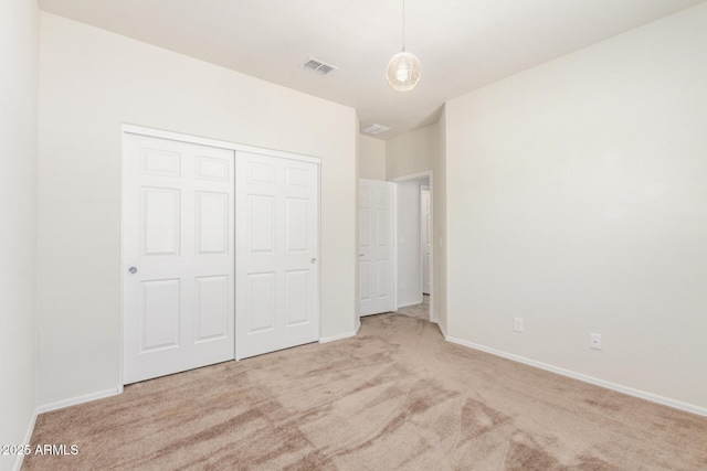25945 W Runion Dr, Buckeye, AZ 85396 - unfurnished bedroom featuring carpet flooring and a closet