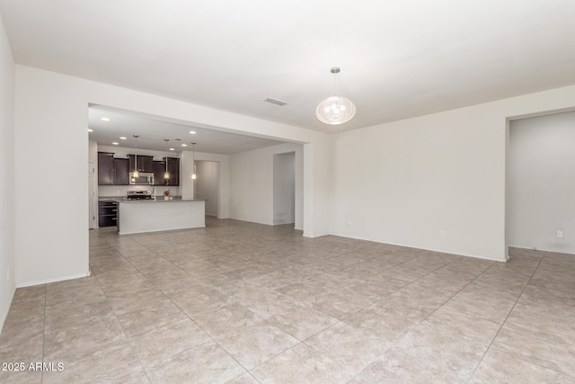 25945 W Runion Dr, Buckeye, AZ 85396 - unfurnished living room featuring recessed lighting
