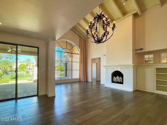 unfurnished living room featuring dark wood-type flooring, wood ceiling, high vaulted ceiling, beamed ceiling, and ceiling fan with notable chandelier