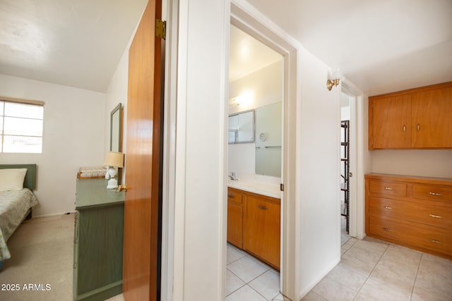 bathroom with tile patterned flooring and vanity