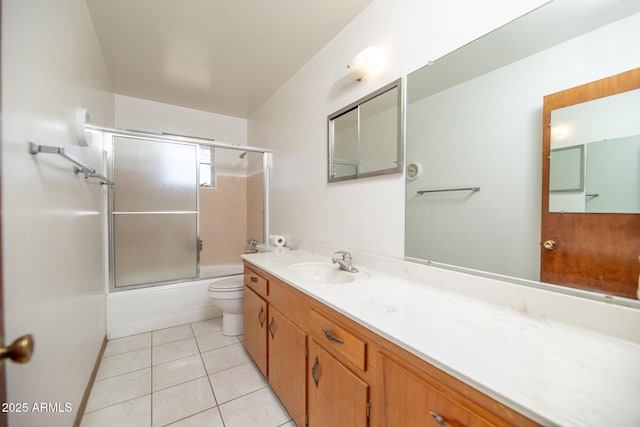 full bathroom with tile patterned flooring, toilet, vanity, and shower / bath combination with glass door