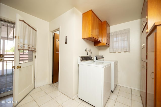 laundry room featuring light tile patterned floors, independent washer and dryer, and baseboards