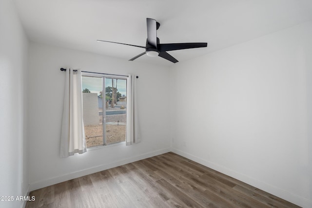 unfurnished room with hardwood / wood-style flooring and ceiling fan