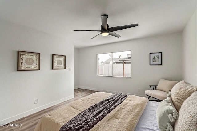 bedroom featuring hardwood / wood-style flooring and ceiling fan