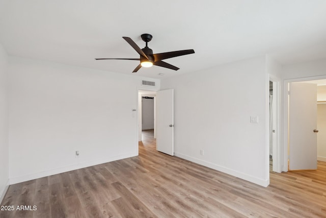 spare room featuring light hardwood / wood-style floors and ceiling fan