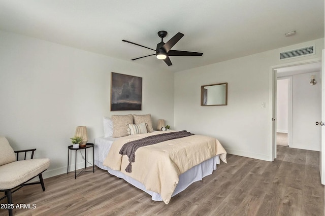 bedroom featuring hardwood / wood-style flooring and ceiling fan