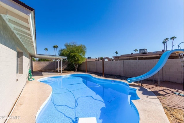 view of pool with a water slide