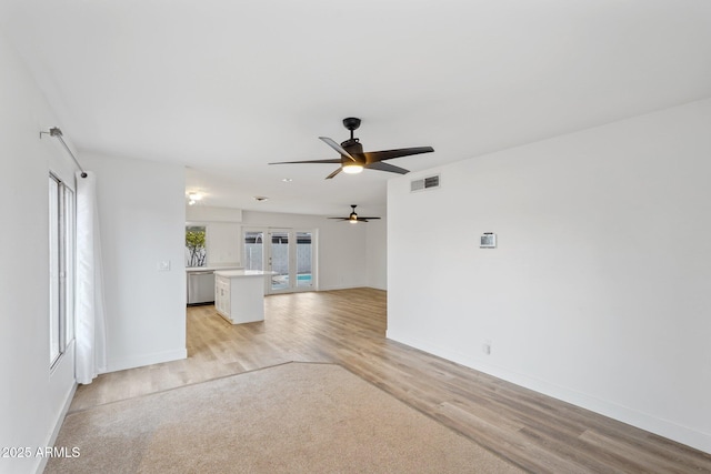 unfurnished living room featuring light wood-type flooring