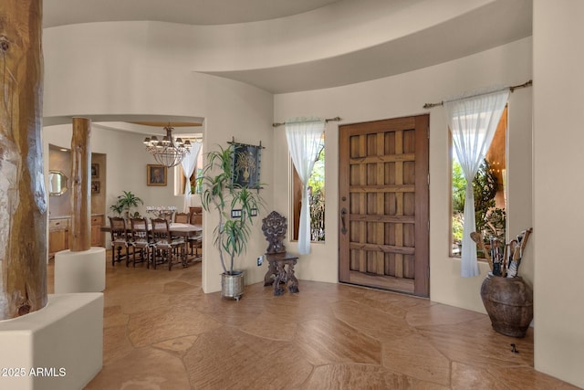 entrance foyer with a notable chandelier