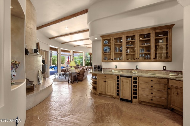 bar with beam ceiling, stone tile floors, wine cooler, and wet bar
