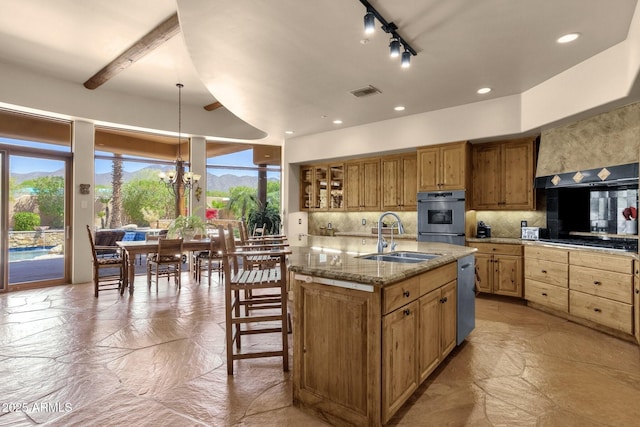 kitchen featuring visible vents, a healthy amount of sunlight, appliances with stainless steel finishes, and a sink