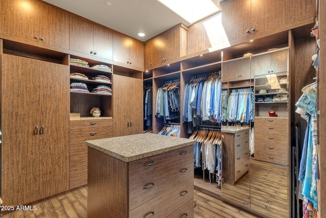 walk in closet featuring light wood finished floors