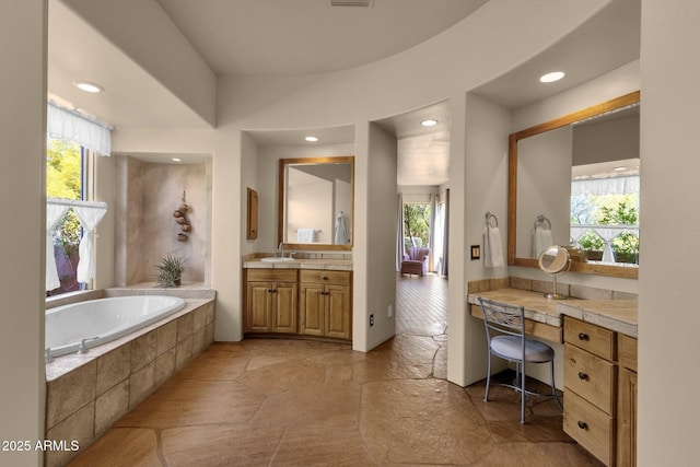 bathroom featuring recessed lighting and a wealth of natural light