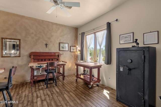 office space featuring wood finished floors and a ceiling fan