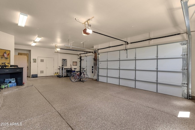 garage featuring a garage door opener