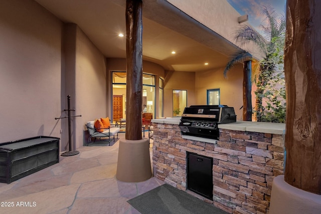 view of patio / terrace with exterior kitchen and grilling area